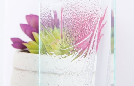 Bamboo Glass Sample Sample image of bamboo textured glass in front of succulent plant and vase.