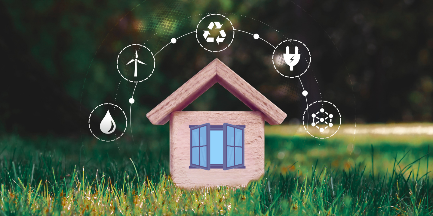 Rendered image of toy wood house on grass field with recycle and energy icons surrounding it.
