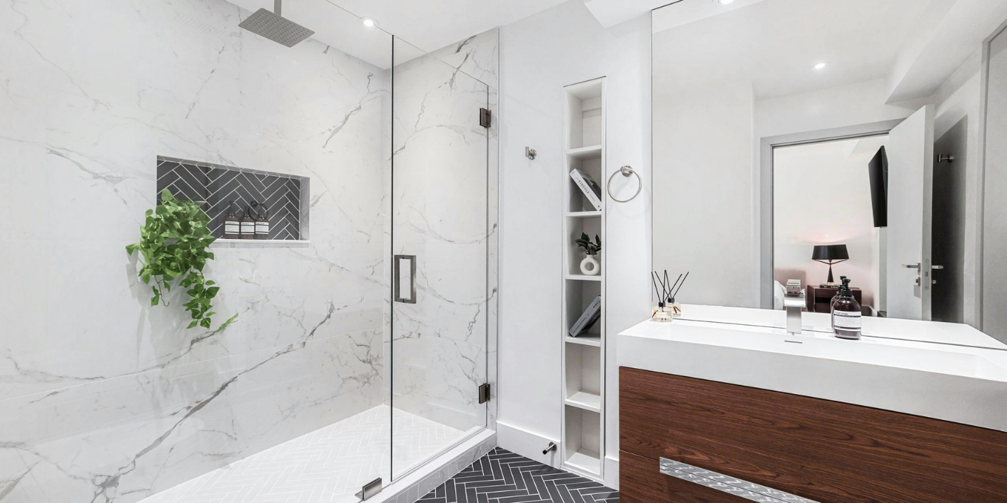 Clean, modern heavy shower enclosure with square hinges and clamps in brushed nickel finish.