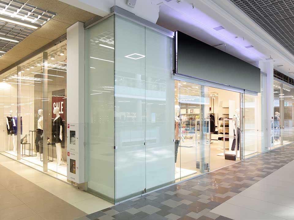 Frameless glass storefront on a retail store in the mall
